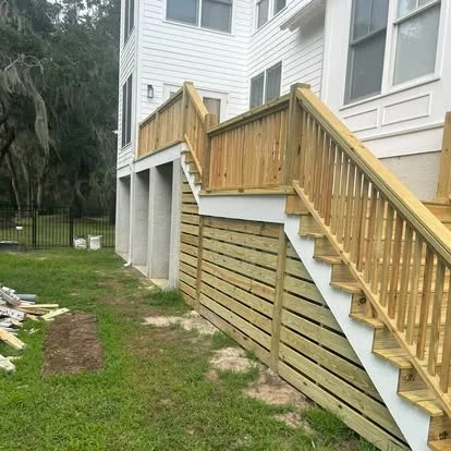 Side view of wood stairs and railing