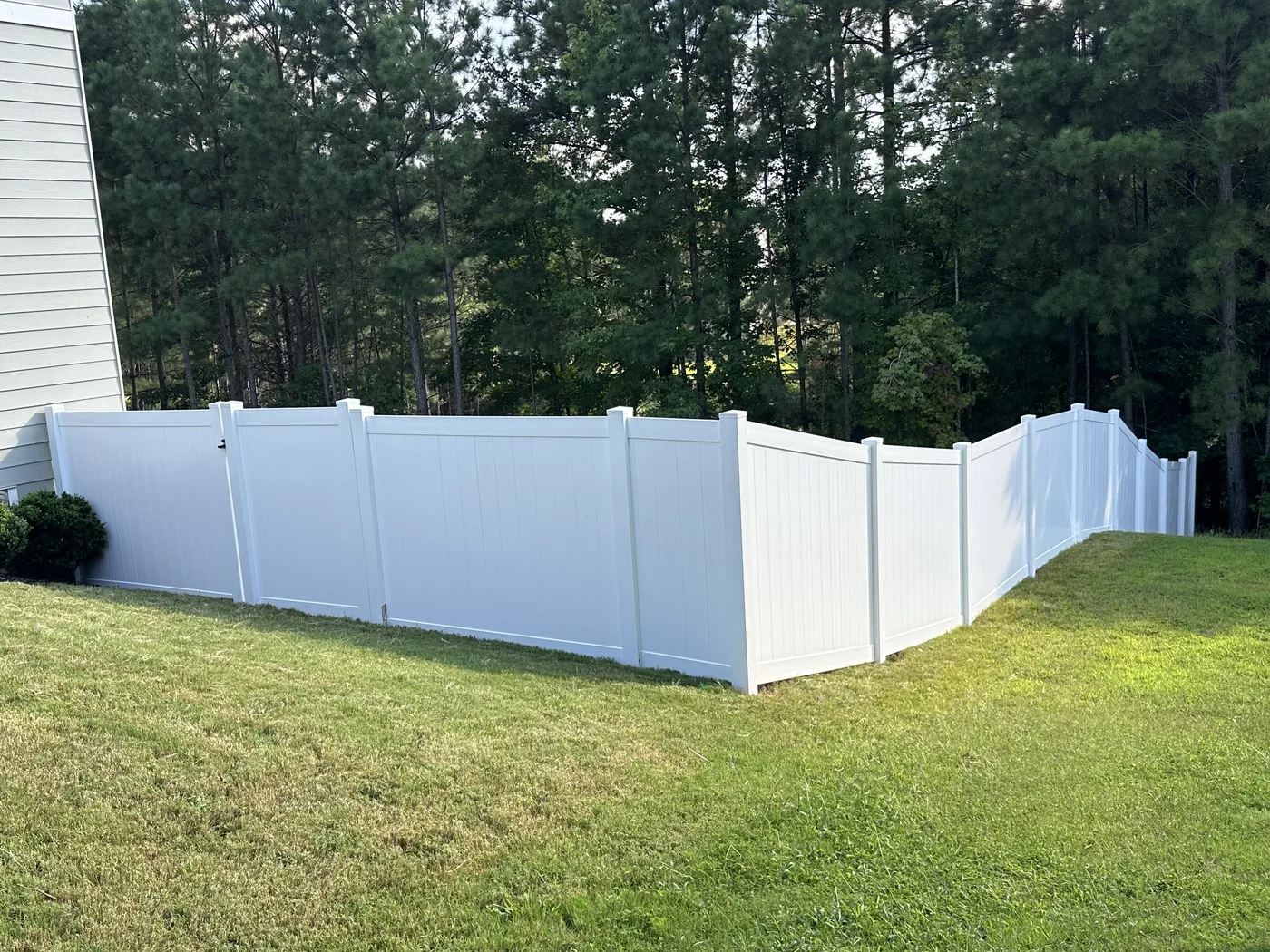 White vinyl privacy enclosure, shared-library reference